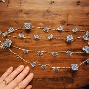 Retro blue flower and gold necklace.